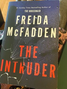 Freida McFadden "The Intruder" Paperback - Navy & Red Cover